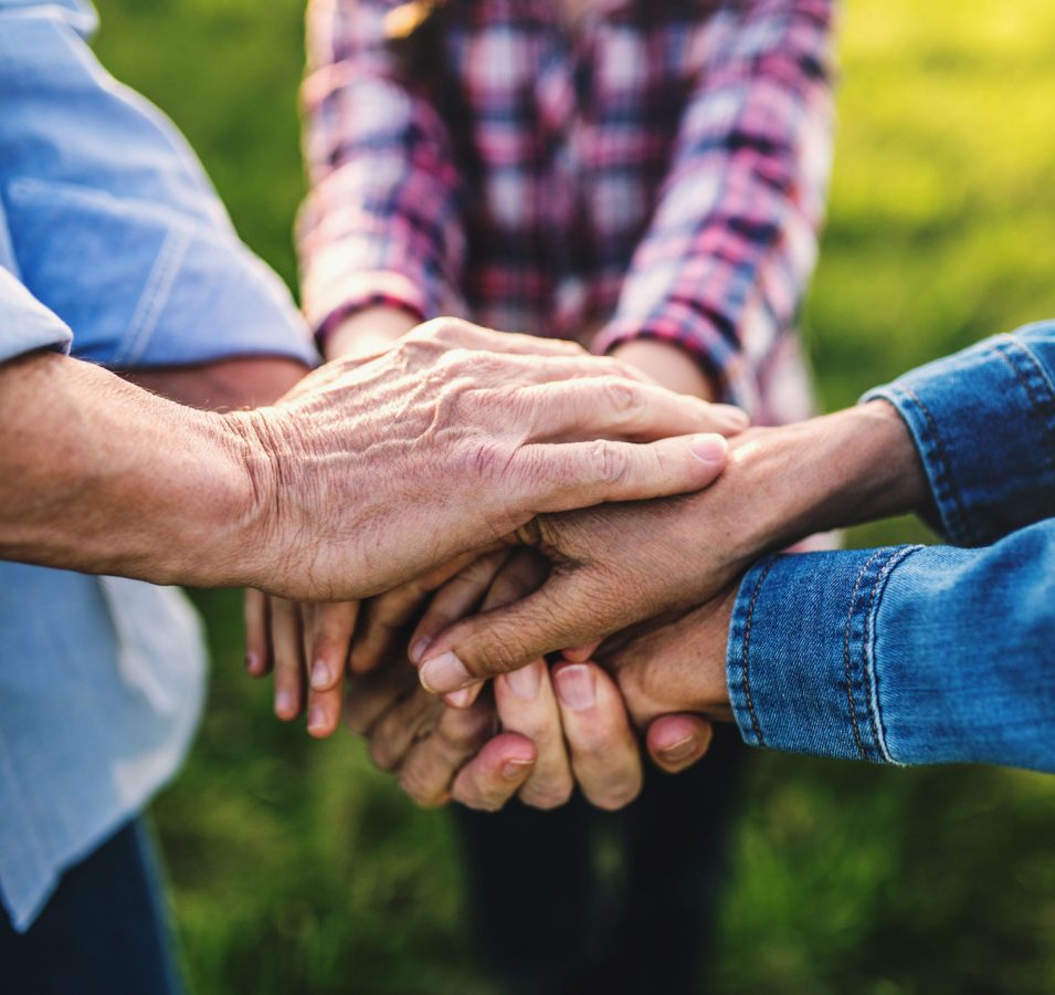 hands-of-small-girl-and-her-senior-grandparents-EKH9UTX.jpg